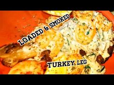 there is a plate of food with shrimp and sauce on the side that says loaded & smoked turkey leg