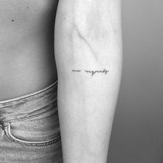 a woman's arm with a tattoo that says happily