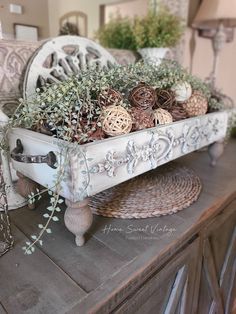 a white tray filled with plants on top of a wooden table