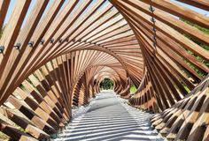 a long wooden walkway lined with lots of wood slats on top of each other