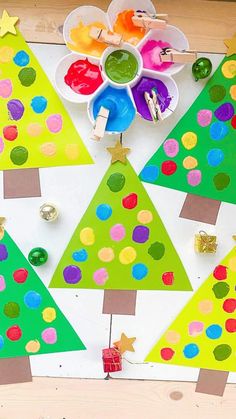 christmas tree craft for kids to make with colored paper and construction supplies on the table