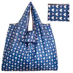 a large blue bag with hearts on it and two small bags in the back ground