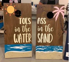 two cornhole game boards with the words toss in the water and toes in the sand