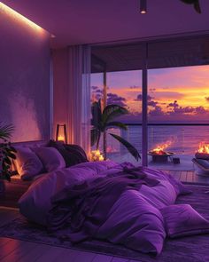 a bed with purple comforter and pillows in front of a window overlooking the ocean