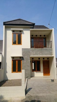 a white house with wooden doors and windows