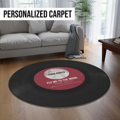 a living room with a couch, table and vinyl record rug that reads personalized carpet fly me to the moon