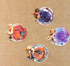 three paper plates with children playing on them