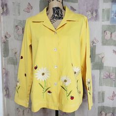 Draper's & Damon's Yellow Floral Ladybug Embroidered Button Front Jacket Size - L Condition - New Without Tags Material: 100% Cotton Measurements: Waist - 23", Length - 28.5" U Collared Embroidered Cotton Outerwear, Collared Cotton Outerwear With Embroidery, Embroidered Cotton Collared Outerwear, Embroidered Cotton Button-up Outerwear, Floral Embroidered Cotton Button-up Outerwear, Spring Embroidered Collared Outerwear, Casual Long Sleeve Outerwear With Machine Embroidery, Fitted Button-up Outerwear With Floral Embroidery, Yellow Embroidered Spring Outerwear