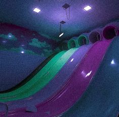 an indoor play area with slides and lights