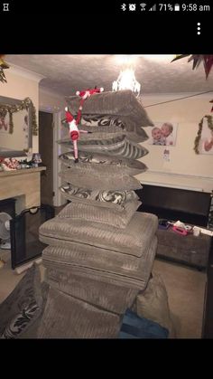 a christmas tree made out of blankets in a living room