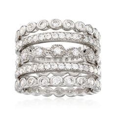 a stack of white gold and diamond rings