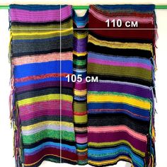 the size and width of a multicolored blanket hanging on a clothes line with measurements