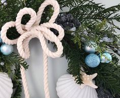 a christmas wreath with an octopus knot and ornaments