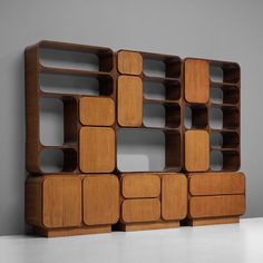 a wooden shelf with several compartments on it