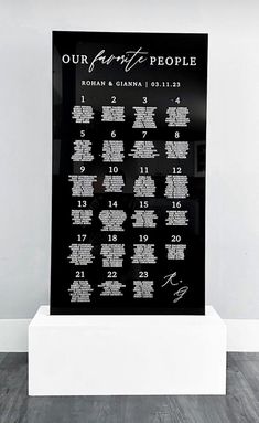 a black and white calendar on display in a room