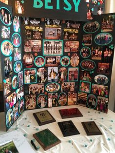 a table topped with lots of pictures and books