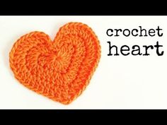 an orange crocheted heart with the words crochet heart written below it