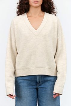 The Wide V Neck Sweater from Lauren Manoogian is a merino wool and baby alpaca sweater with an elegant v neck and drop shoulder design for the perfect cold weather essential. With a ribbed bottom hem, neckline, and cuffs, this cozy sweater is a combination of comfort and timeless. Cream Cashmere V-neck Sweater, Beige V-neck Sweater With Ribbed Cuffs, Cream V-neck Sweater With Ribbed Cuffs, White Wool V-neck Sweater, Cream V-neck Sweater For Work, Cream Soft Knit V-neck Sweater, Wide V Neck, Lauren Manoogian, Tassel Scarf