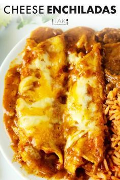 a white plate topped with pasta and cheese enchiladas next to rice on a table