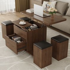 a coffee table with two stools and a laptop on it