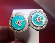 "Unique pair of clip-on earrings. They look handmade. Not identical or symmetrical. Have a thunderbird and turquoise design on a silver base. 3/4\" diameter Check out other items in our shop by visiting : www.etsy.com/shop/vintagegoldenmoments Import duties, taxes and charges are not included in the item price or shipping charges. These charges are the buyer's responsibility. Please check with your country's customs office to determine what these additional costs will be prior to bidding/buying. Turquoise Design, Silver Turquoise, Vintage Earrings, Turquoise Ring, Clip On Earrings, Lincoln, Jewelry Accessories, Turquoise, Silver