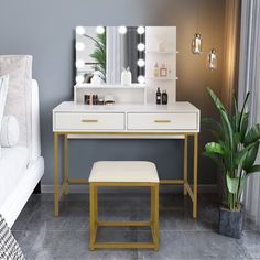 a white vanity with lights on and a stool in front of it next to a bed