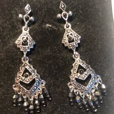 Nwot Metal Earrings That Won’t Weigh Down Your Lobes. Lightweight But Look Like Heavy Metal Or Silver. Small Black Stones On Several Parts Of The Earring. Measures About 2” In Length. Great Earrings For You Or As A Gift. Comes With Box. Silver Metal Beaded Dangle Earrings, Silver Metal Beaded Earrings, Silver Beaded Pierced Earrings, Silver Nickel-free Chandelier Earrings For Evening, Black Stones, Metal Earrings, Earrings Color, Black Stone, Long Earrings