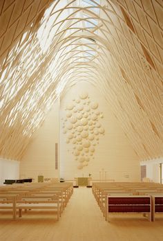 the inside of a church with wooden pews