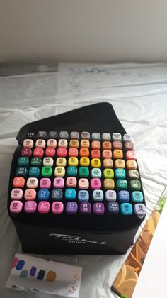 a colorful keyboard sitting on top of a bed