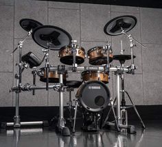 a set of drums sitting in front of a wall