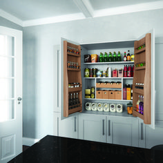 an open pantry with lots of bottles and condiments on the shelves in it