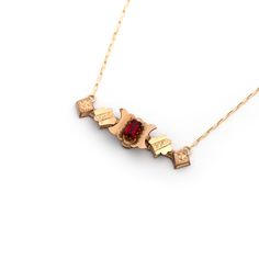 This one-of-a-kind conversion necklace is made up of: Gold filled Victorian bar pin pendant from the late 1800s with hand engraved details and a red paste glass stone. Pendant measures 2" wide. New 14k gold filled chain that measures a standard 16”. Necklace pictured measures 16”. If desired, an adjustable chain length may be built into the chain to be more versatile, adjustable from 16-17-18 inches or from 18-19-20 inches. Wear this necklace shorter or longer depending on the neckline of what y Red Engraved 14k Gold Jewelry, 14k Gold Red Engraved Jewelry, Red 14k Gold Engraved Jewelry, Red Antique Engraved Necklace, Victorian Red Engraved Necklace, Antique Red Engraved Necklace, Red Victorian Engraved Necklace, Antique Engraved Red Jewelry, Red Pendant Necklace With Vintage Charm