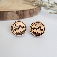 These beautiful wooden mountain scenery stud earrings are meant for every nature lover, hiker, and adventurer alike. Best of all, they are also hypoallergenic, lightweight, and great for everyday wear! Each pair of earrings is laser cut in-house using sustainable American hardwood and sealed with a hypoallergenic shellac topcoat. Earrings are finished with hypoallergenic stainless steel posts. Material: sustainable American hardwood Sizing: 0.5 inch L x 0.5 inch W Mountain And Forest, Mountain Earrings, Bee Studs, Mountain Lover, Mountain Scenery, Bee Earrings, Gifts For Nature Lovers, Wood Earrings, Cleaning Jewelry