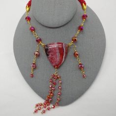 Check out this item in my Etsy shop https://www.etsy.com/listing/872670940/red-beadsspiral-bead-crochettassel Handmade Red Beaded Lariat Necklace, Adjustable Beaded Necklace With Czech Glass Dangling Beads, Adjustable Dangle Crystal Necklace With Faceted Beads, Unique Adjustable Necklaces With Faceted Beads, Unique Adjustable Necklace With Faceted Beads, Red Bohemian Lariat Necklace, Adjustable Czech Glass Necklaces With Dangling Beads, Adjustable Czech Glass Necklace With Dangling Beads, Adjustable Dangle Glass Necklace