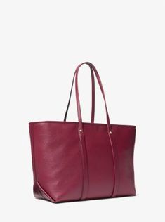 The Beck tote bag is sure to become one of your favorites, thanks its pebbled leather craftsmanship and minimalist design. The spacious interior features two slip pockets to keep small items close at hand and has plenty of room for a tablet, notebook and headphones. Reach for it on long commutes or day trips. Red Leather Bag, Purple Bags, Kors Jet Set, Black Tote Bag, Blue Bags, Leather Tote Bag, Beck, Small Items, Day Trips