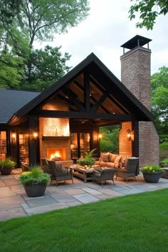 an outdoor living area with furniture and fire place