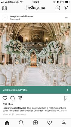 the instagram page on instagram shows an image of a wedding ceremony with white flowers and greenery