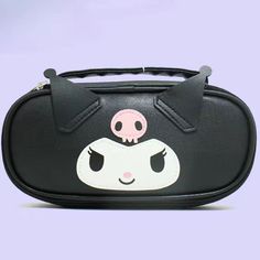 a black and white bag with a cat face on the front, it has two eyes that look like cats