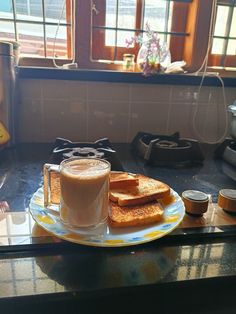 there is a plate with toast and coffee on it