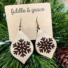 "Fiddle and Grace is proud to offer affordable, lightweight super cute earrings! Need something to add to all your festive Christmas outfits? This pair of adorable, lightweight earrings is the perfect touch! They measure 1.8\" wide x 1.8\" tall and 1/8 inch thick. The ones in the listing photo are made of White Oak and custom laser cut with a Classic Silver Nickel Free French Hook Ball Earwire. We do finish our wood with a non-toxic sealer, this does not make them waterproof, however, since the Holiday Winter Drop Earrings, Winter Holiday Drop Earrings, Winter Festive Dangle Earrings, Winter Gift Drop Earrings, Snowflake Earrings For Winter Gift, Winter Snowflake Earrings For Gifts, Wood Burn Earrings, Xtool Projects, Festive Christmas Outfit