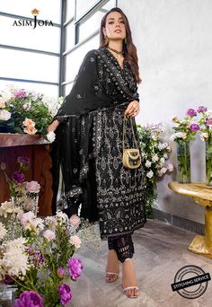 FABRIC: LAWNCOLOR: BLACK PRODUCT DETAILS Iqra slays in this classy noir ensemble brought to life by heavily done chickankari embroidery done in herringbone stitch adorned with 5 mm muted copper sequins and banarsi zari working wonders in this design. It comes with an embroidered chiffon dupatta and solid dyed pants.DESIGN DETAILS:1.25 meters Embroidered Jaal For Front on lawn (W 32" H 45")1 piece Embroidered Chan on lawn for back32” Embroidered border for front daaman32” Embroidered border for b Elegant Black Sharara For Festive Occasions, Eid Black Georgette Anarkali Set, Elegant Black Sharara With Zari Work, Black Georgette Anarkali Set For Eid, Bollywood Style Black Palazzo Set For Eid, Elegant Black Georgette Sharara, Bollywood Black Palazzo Set For Eid, Elegant Black Georgette Set, Elegant Black Traditional Wear With Zari Work