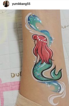 Simple Mermaid Face Paint, Seashell Face Paint, Mermaid Face Paint Kids Easy, Face Painting Mermaid, Face Paint Mermaid, Face Paint On Arm, Arm Paint Ideas, Mermaid Face Painting, Mermaid Face Paint