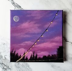 a painting of a purple sky with string lights hanging from it's end and the moon in the distance