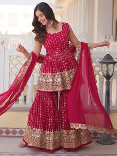 Elevate your ethnic wardrobe with our stunning "alluring rani pink sequins georgette wedding wear sharara suit." This three-piece ensemble includes a georgette suit, sharara, and dupatta, all adorned with intricate sequin work and thread embroidery in a beautiful rani pink color. The fully stitched sharara suit is available in sizes M to XXL, making it perfect for weddings, receptions, festivals, and special functions. Pair it with some accessories to complete your elegant look and stand out at any event. Crafted with high-quality georgette fabric, this sharara suit offers a comfortable and stylish fit for all-day wear. The sequin work and thread embroidery add a touch of glamour and sophistication, making it a must-have for any special occasion. Pink Gharara, Sharara Suit Designs, Pink Sharara, डिजाइनर कपड़े, Gharara Suits, Sequin Suit, Party Wear Kurtis, Embroidered Sarees