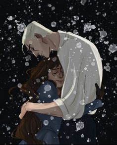 a man and woman hugging in the snow with falling snowflakes around them on a black background