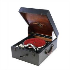 an old fashioned record player in a black case with red velvet lining and silver handles