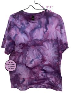 a purple tie dye shirt hanging on a clothes hanger with the words mom made cotton clothing