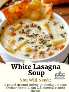 a bowl of white lasagna soup with bread on the side