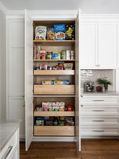 an organized pantry in a white kitchen