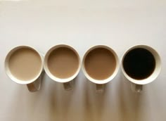 five coffee cups lined up in a row